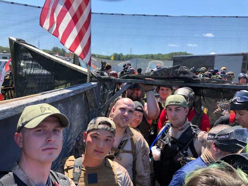Team members at a paintball event